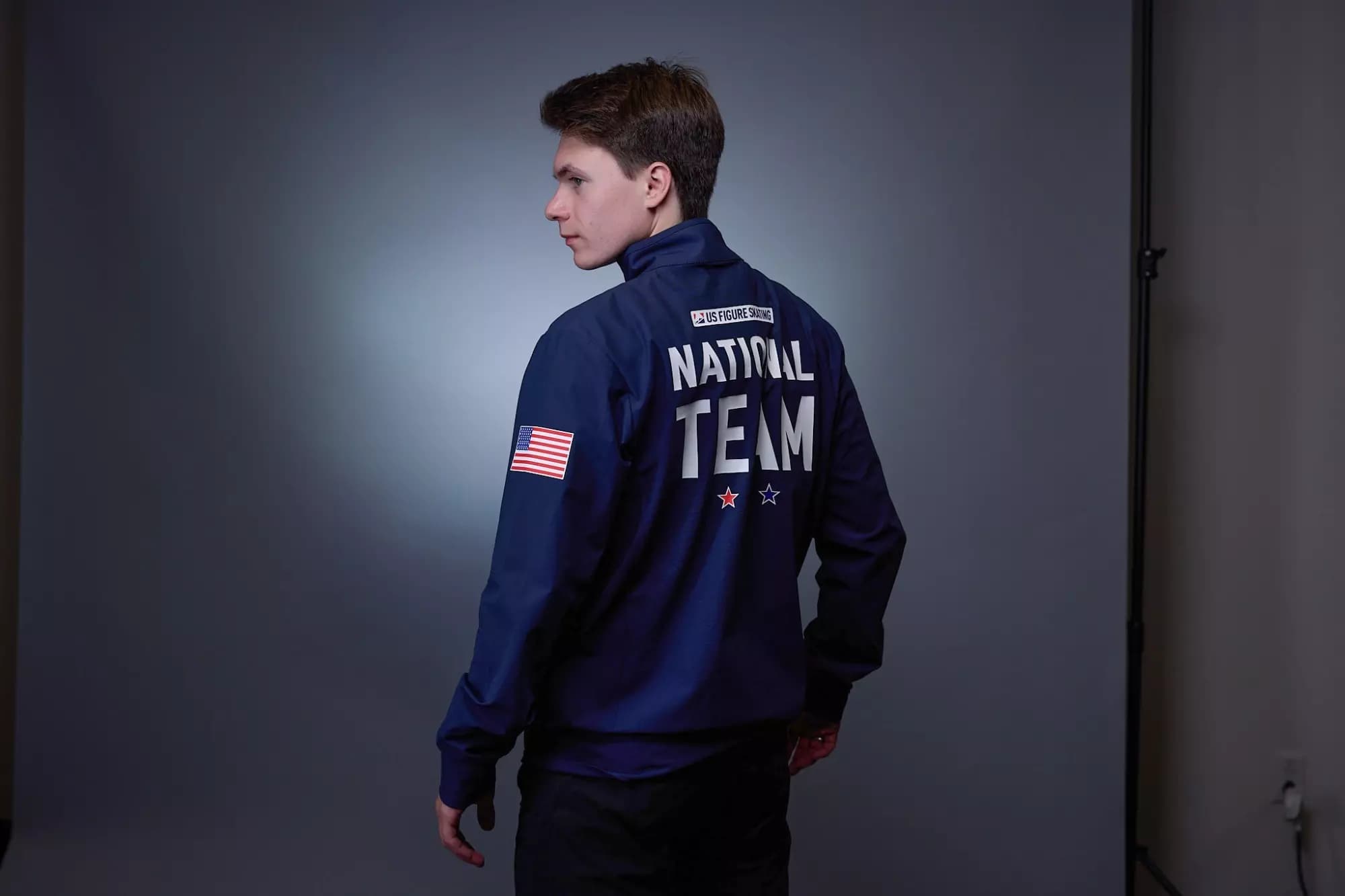 Max facing left exposing the back of his US National Team jacket